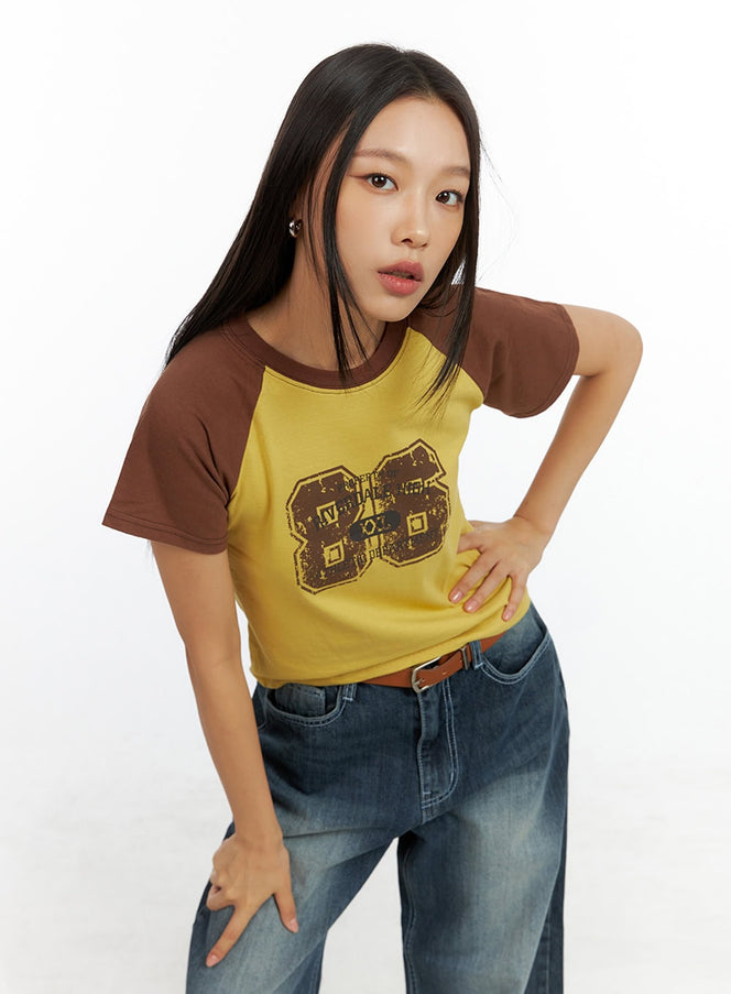 contrasting-cotton-graphic-raglan-tee-il409 / Yellow